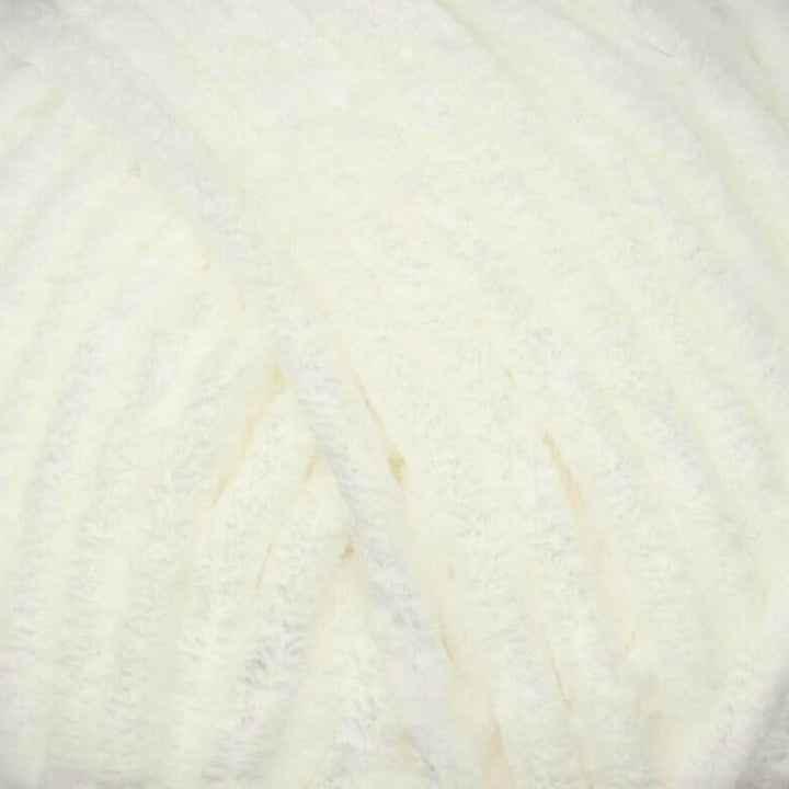 A close-up of fluffy white velvet yarn with soft, textured vertical loops.