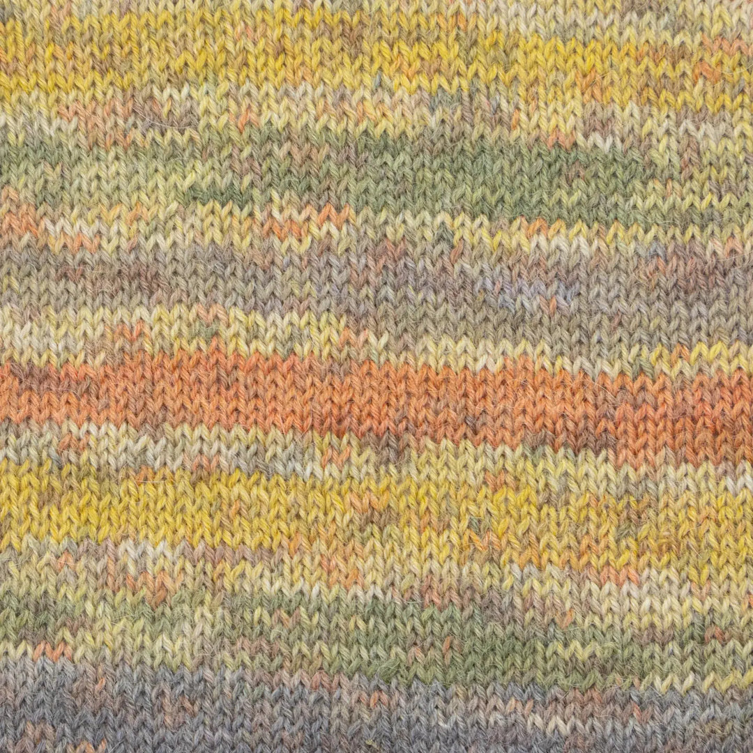 Close-up of a knitted fabric with multicolored stripes