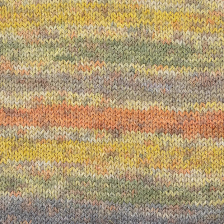 Close-up of a knitted fabric with multicolored stripes