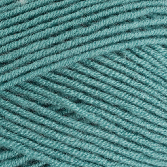 Close-up of teal yarn with a textured pattern