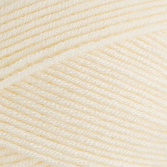 Close-up of cream-colored yarn with a textured pattern