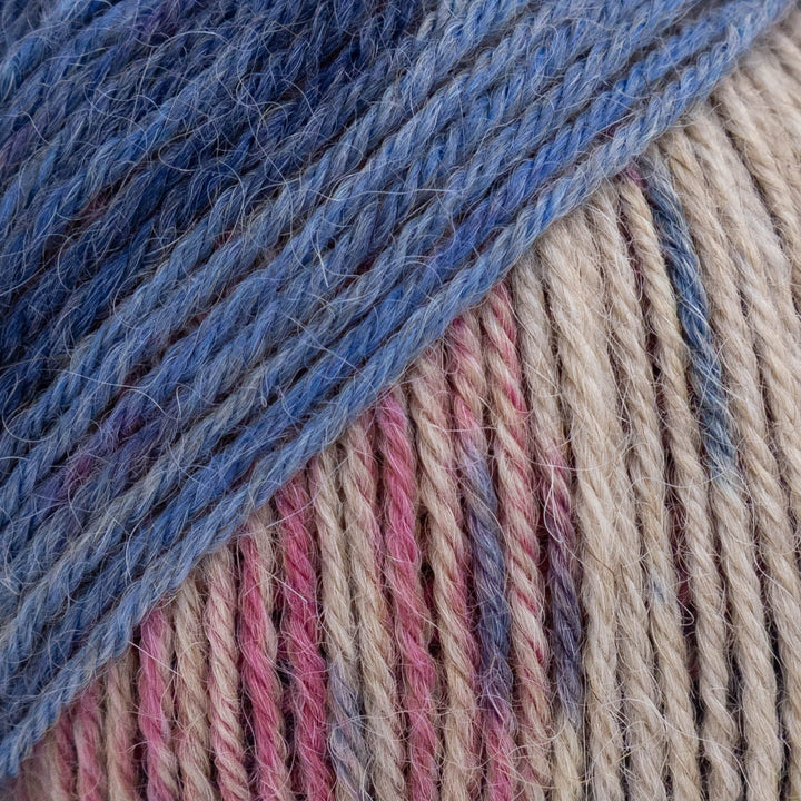 Close-up of blue and multicolored yarn strands