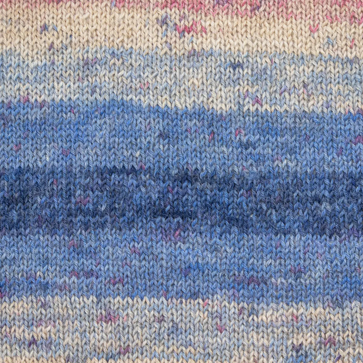 Close-up of a knitted fabric with blue and beige stripes