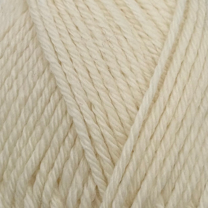 A close-up of cream-colored twisted yarn strands filling the frame.