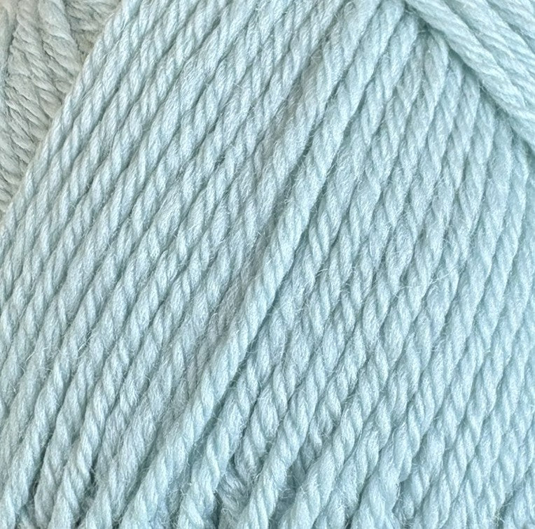 A close-up of pale icy blue plied yarn, showing the twisted texture of the fibers.