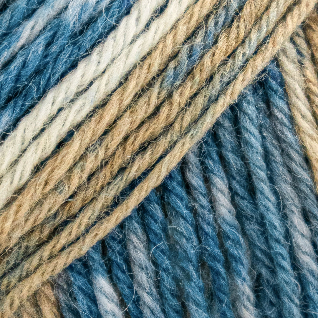Close-up of blue and beige yarn strands