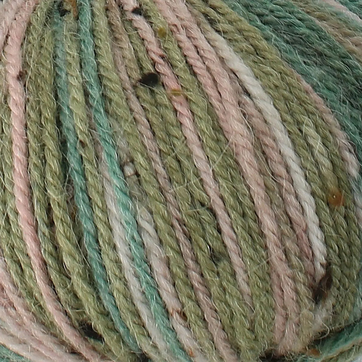 Close-up of a skein of multicolored yarn with green, pink, and beige tones.