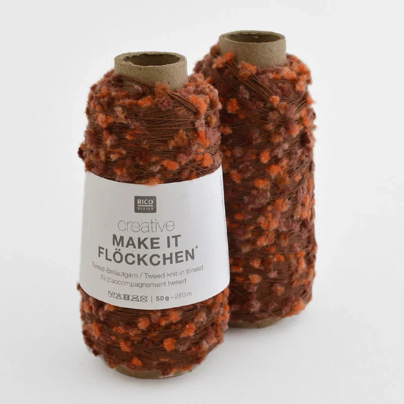 Two cones of Rico Design creative Make It Flockchen tweed yarn in a brown and orange mottled pattern, shown on a clean white background.