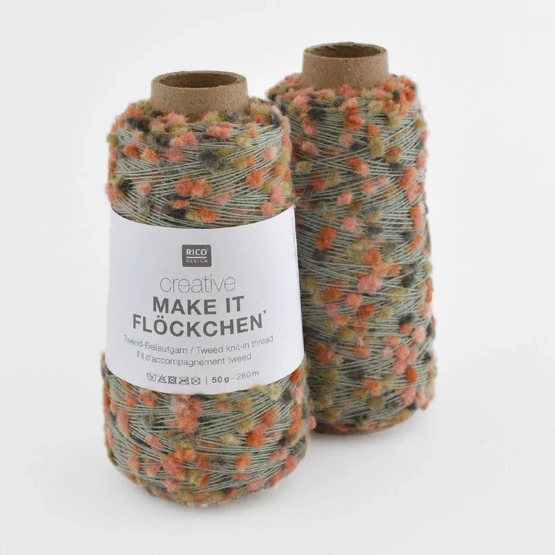 Two cones of Rico Design Creative Make It Flockchen tweed knitting thread in a variegated colorway of gray, orange, and beige, shown on a clean white background.