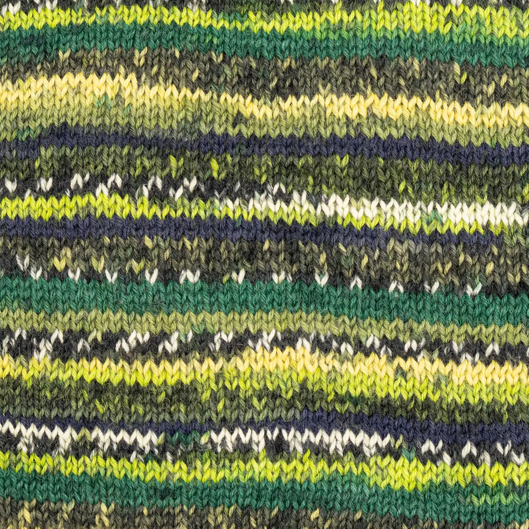 Close-up of a knitted fabric with green, yellow, and black stripes.
