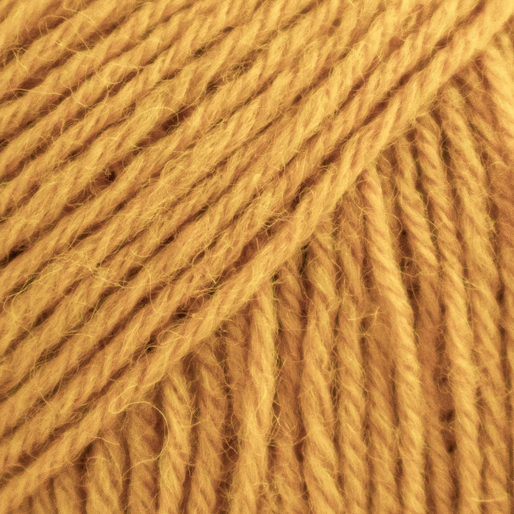 Close-up of a ball of orange yarn
