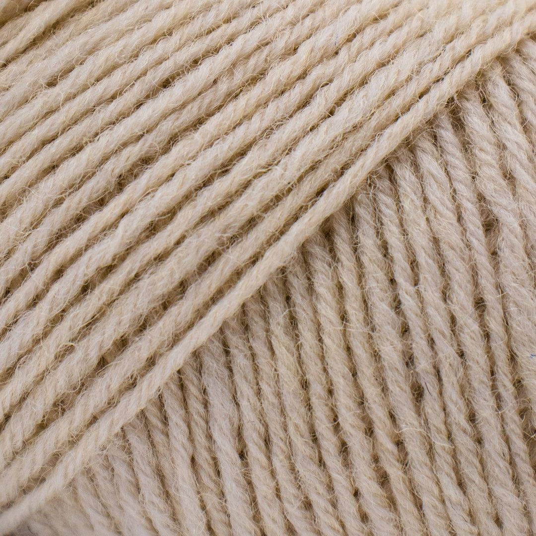 Close-up of beige yarn strands