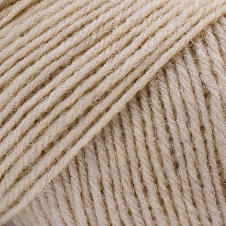 Close-up of beige yarn strands