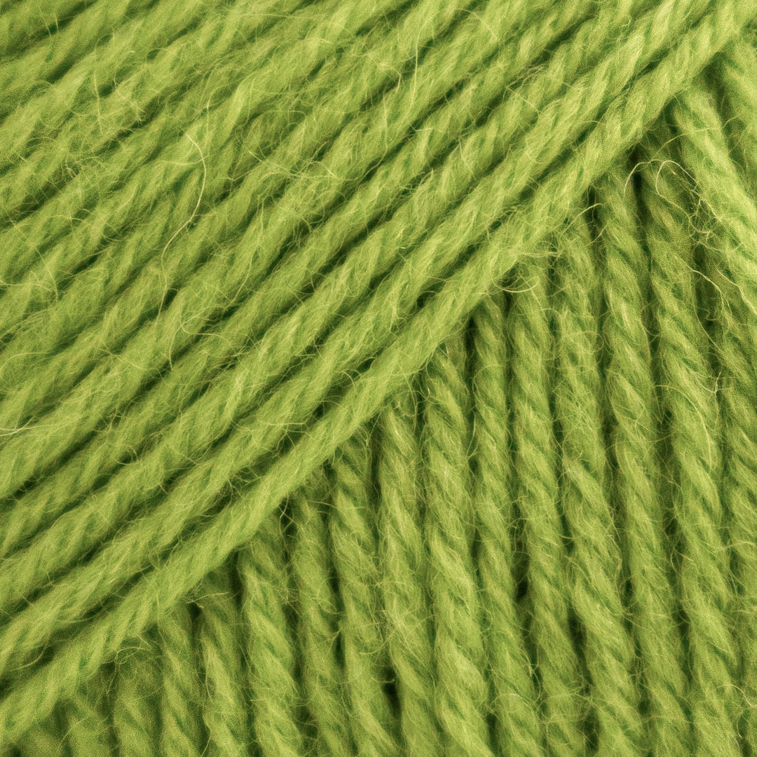 Close-up of green yarn with visible texture
