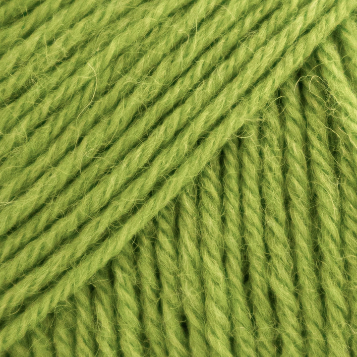 Close-up of green yarn with visible texture