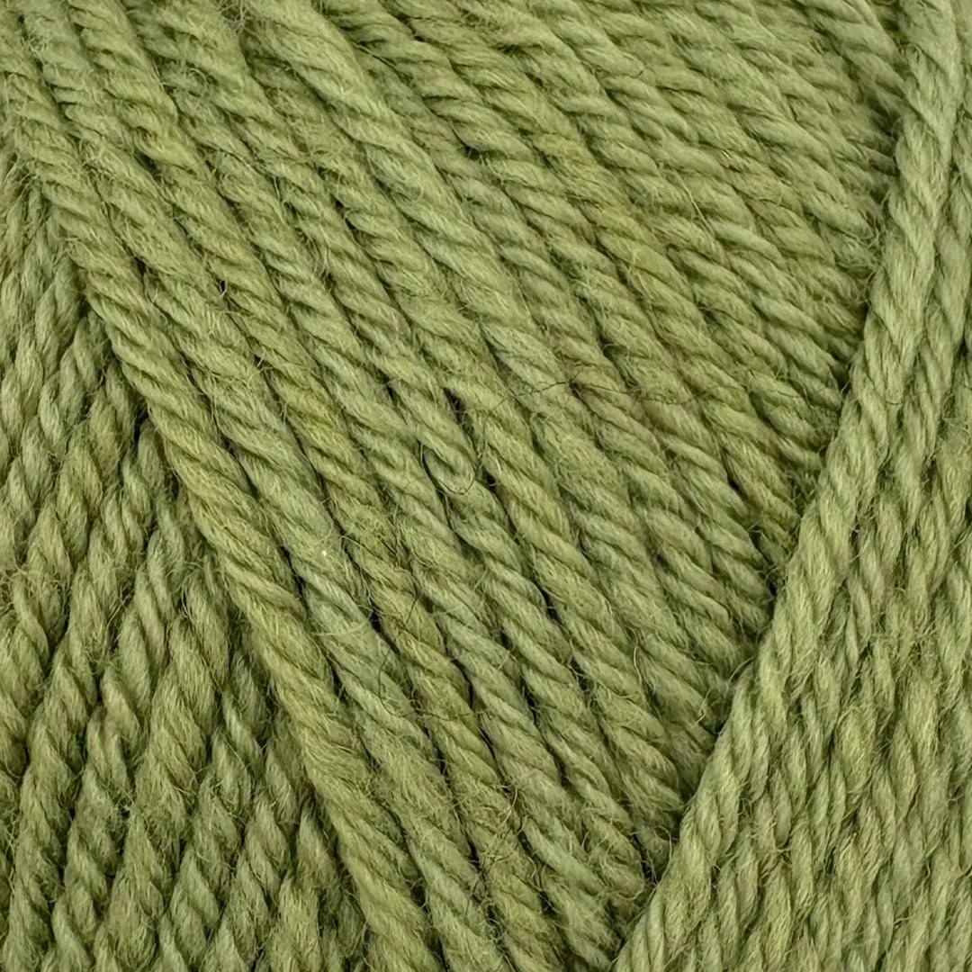 A close-up of olive green yarn strands twisted into a skein, showing the texture and color of the wool or acrylic fiber.