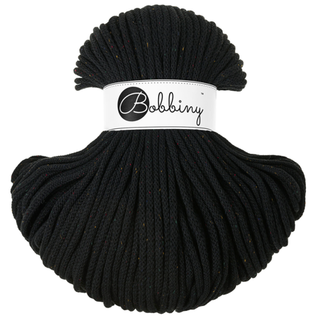 Black skein of yarn with coloured flecks and 'Bobbiny' label on a white background