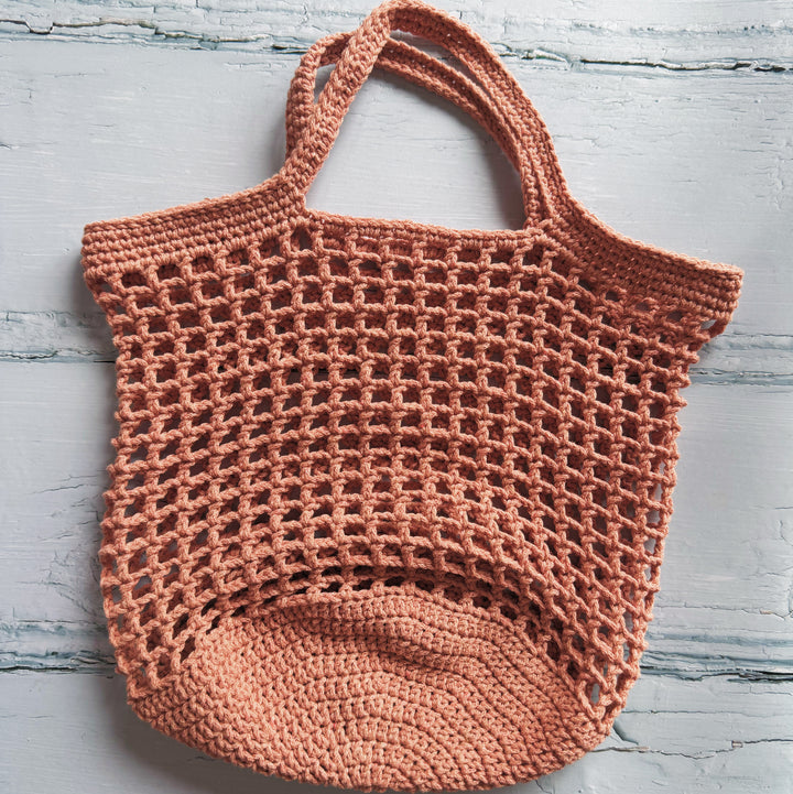 Crocheted bag on a light gray background