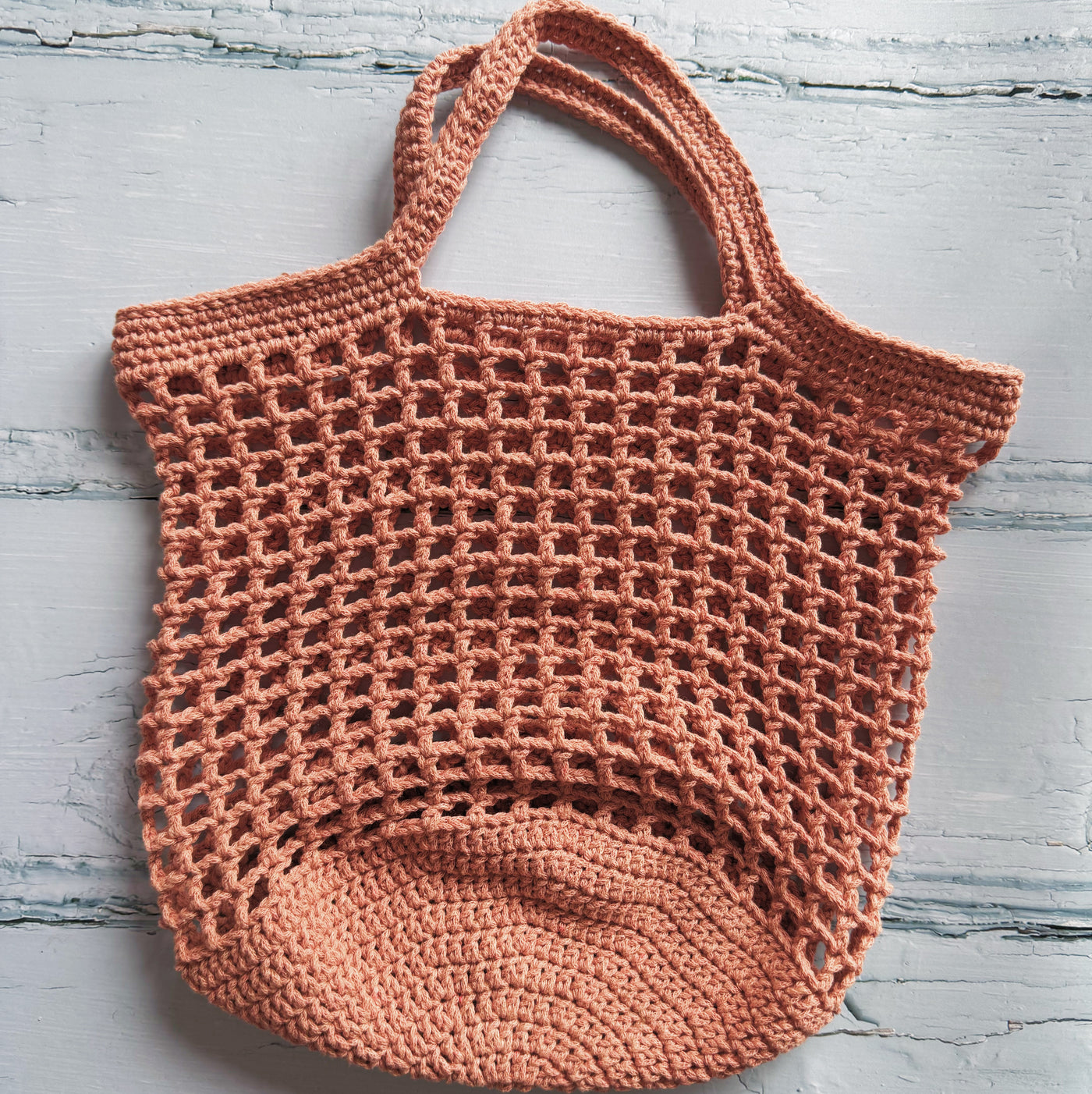 Crocheted bag on a light gray background