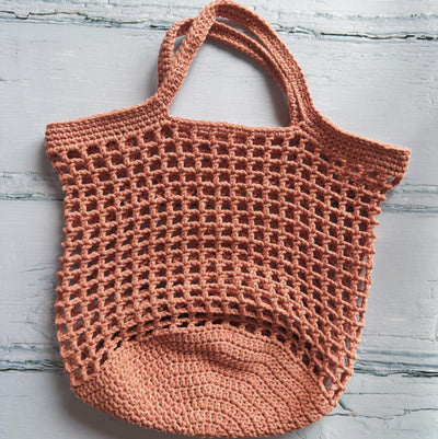 Crocheted bag on a light gray background