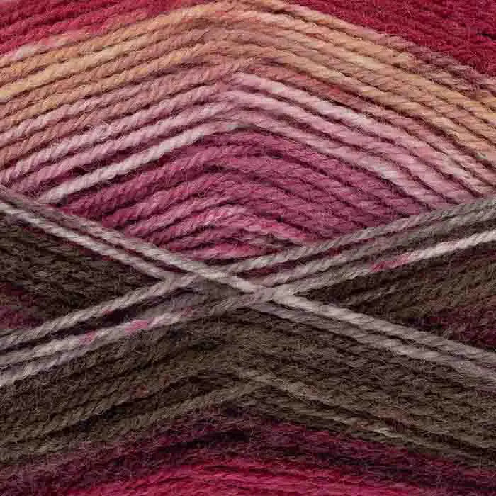 Close-up of multicolored yarn with pink, brown, and red tones.
