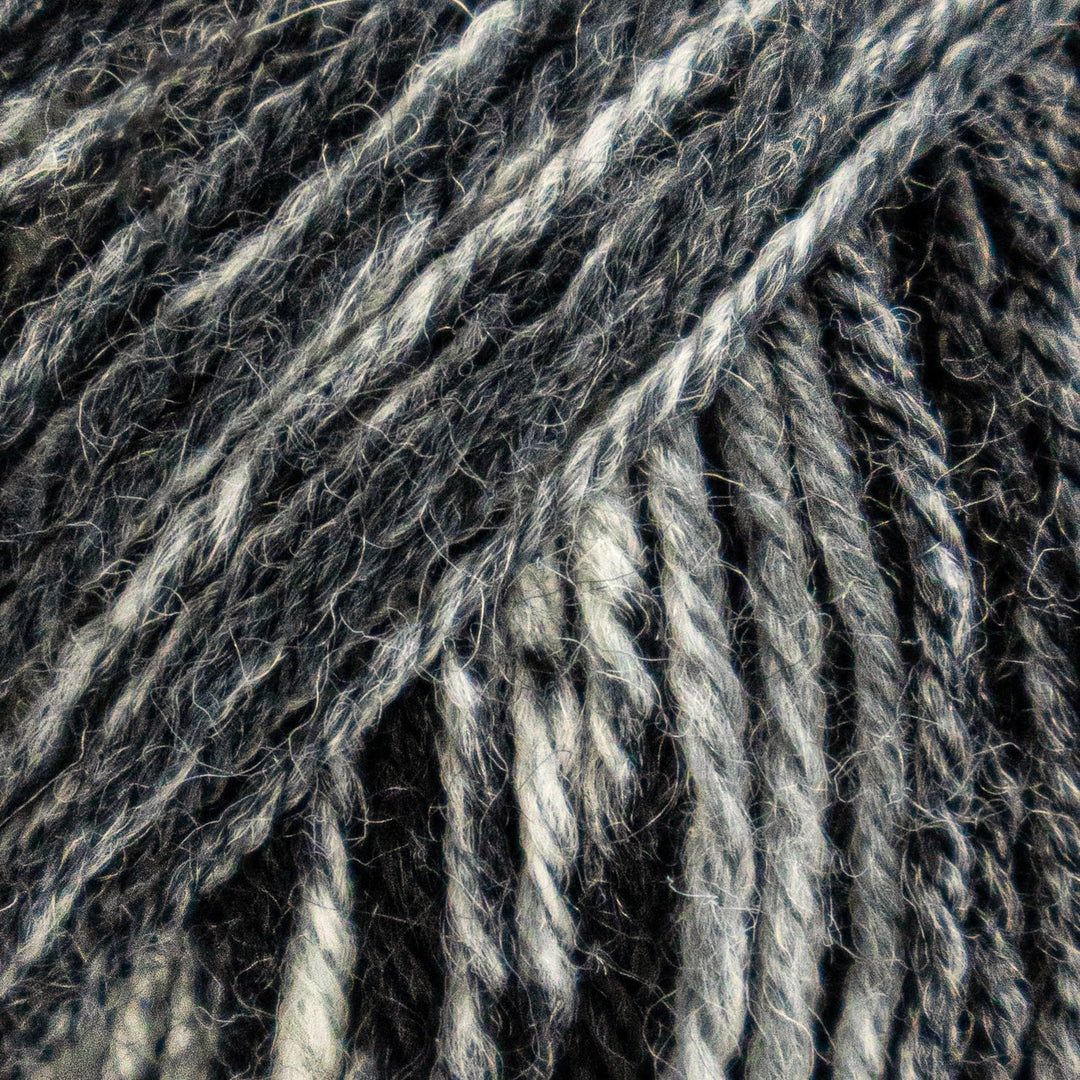 Close-up of gray and white yarn strands