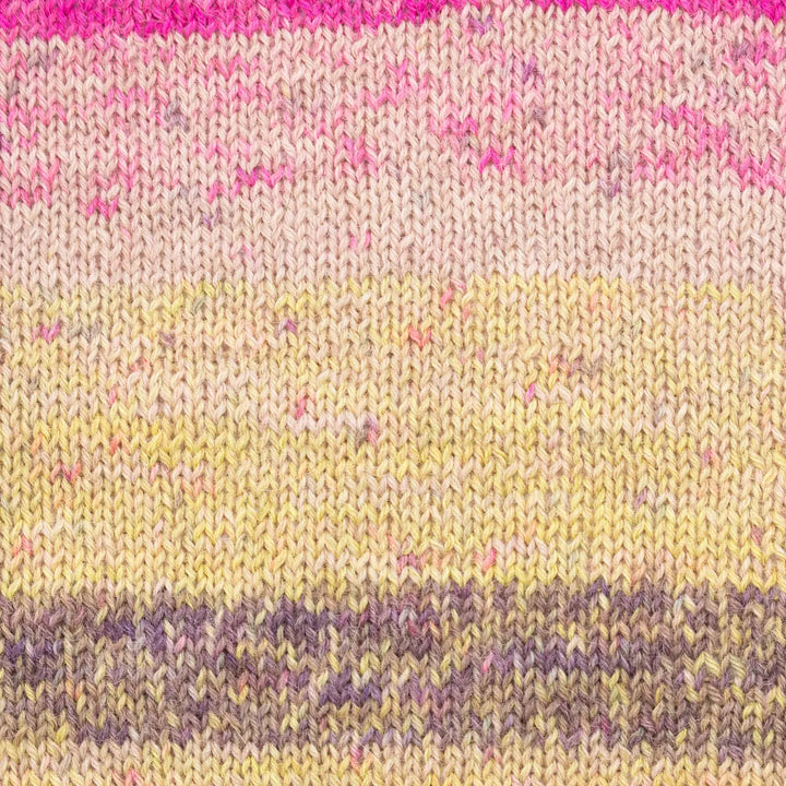 Close-up of a knitted fabric with pink, yellow, and purple stripes.