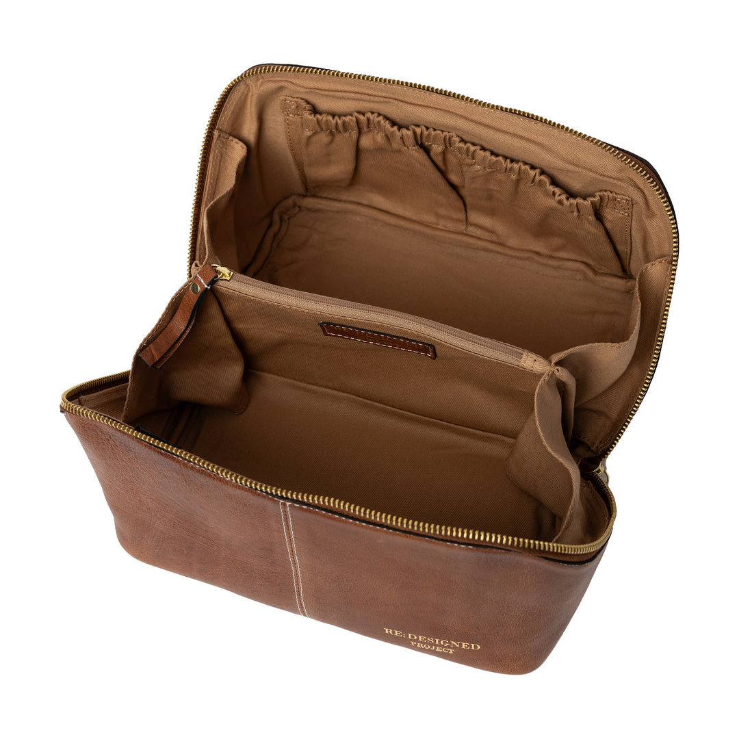 Brown leather yarn bag with visible brand name on a white background