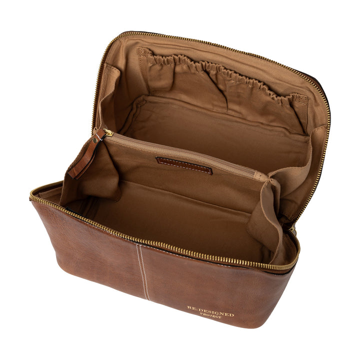 Brown leather yarn bag with visible brand name on a white background