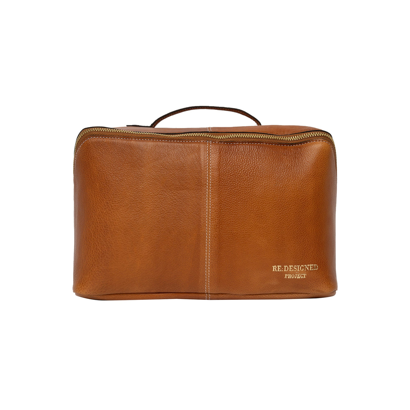 Brown leather toiletry bag with 'RE DESIGNED' label on a white background
