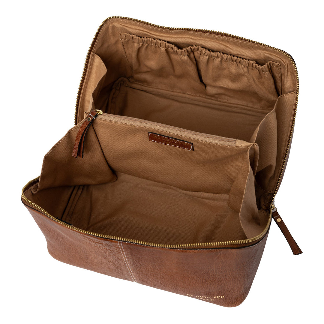 Brown leather yarn bag with open compartments on a white background