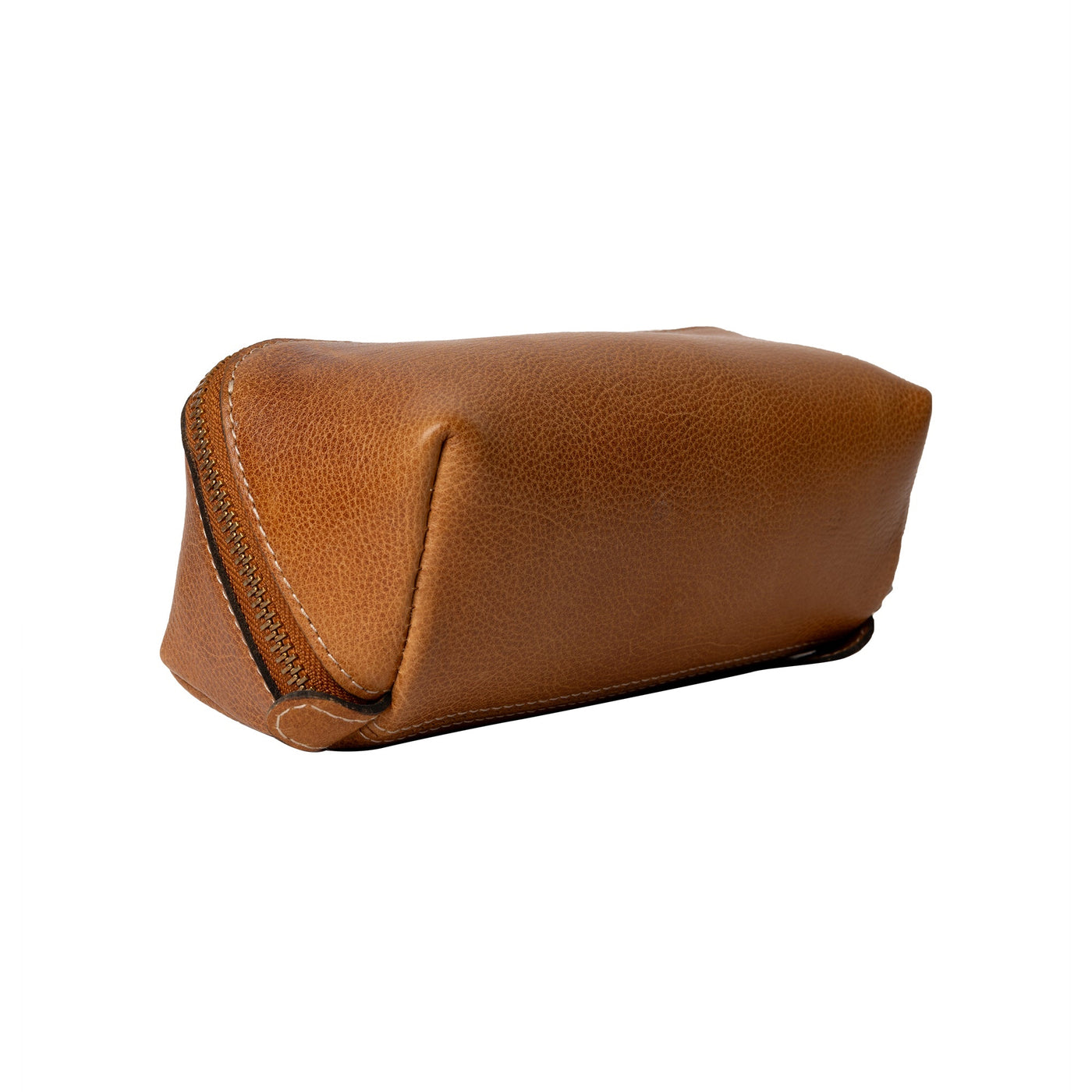 Brown leather toiletry bag on a white background