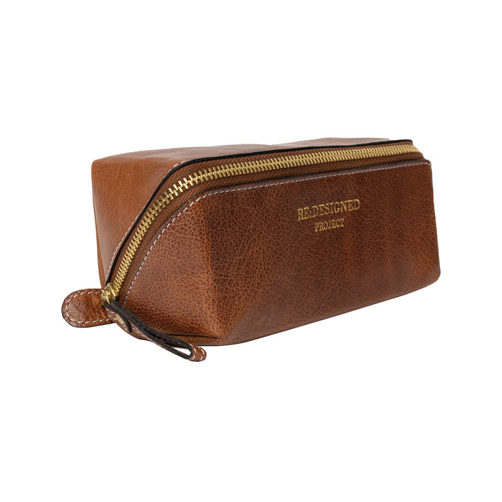 Brown leather pouch with gold zipper on a white background