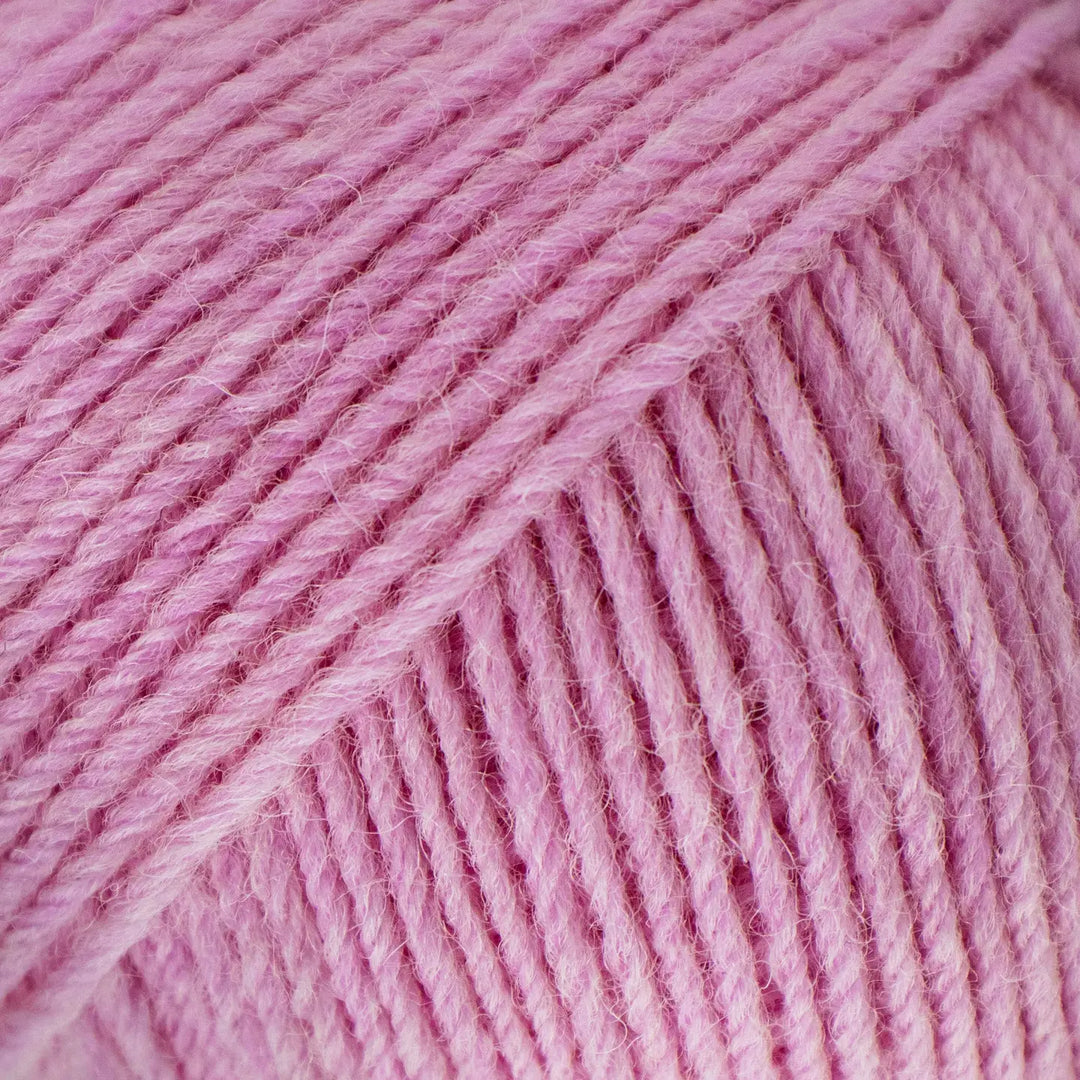 Close-up of pink yarn with visible texture