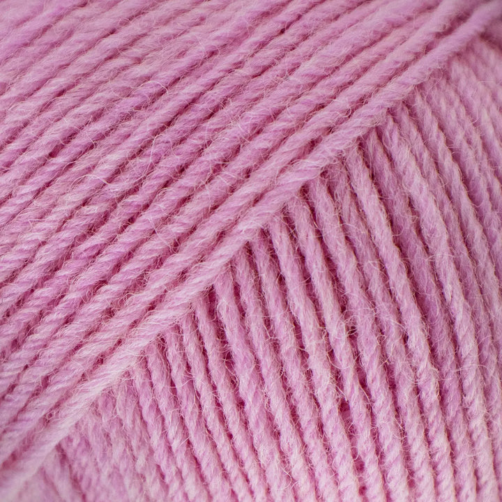 Close-up of pink yarn with visible texture