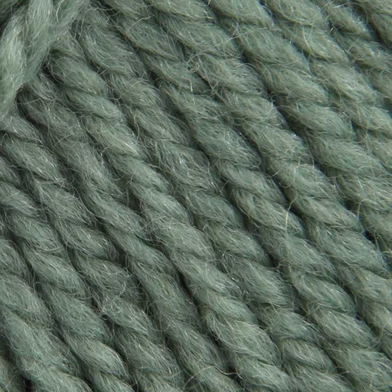 A close-up texture shot of twisted yarn in a muted sage green color, showing the fuzzy, soft fibers in detail.