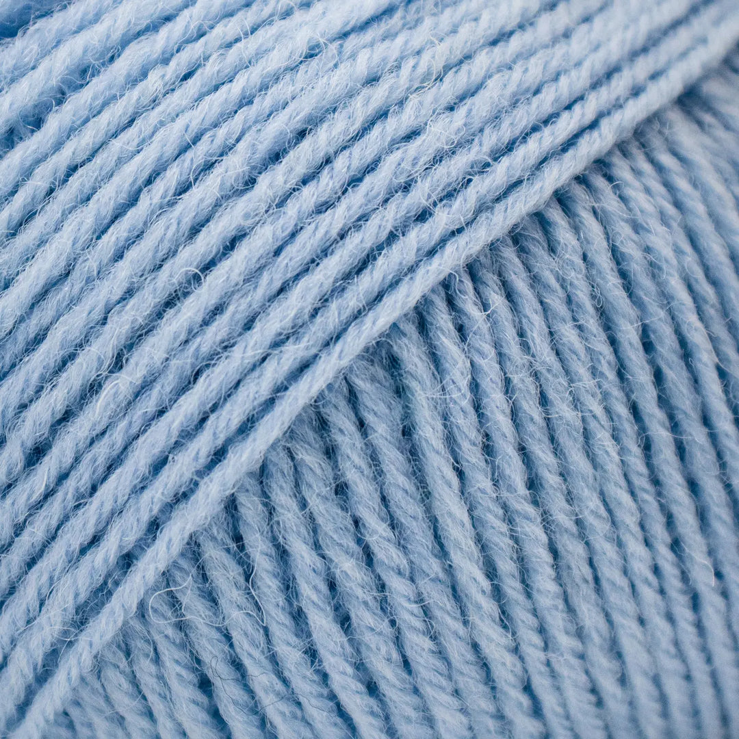 Close-up of blue yarn with a textured surface