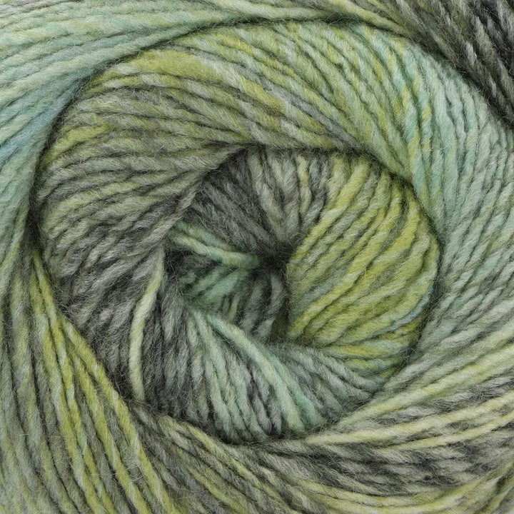 Close-up of a skein of multicolored yarn with green and gray tones.