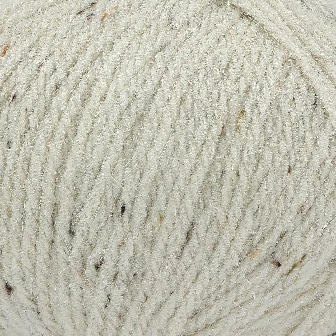 Close-up of beige yarn with natural variations