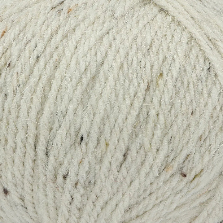 Close-up of beige yarn with natural variations