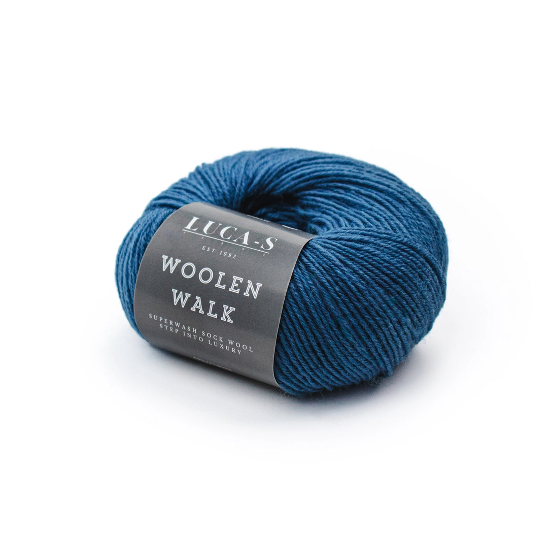Blue skein of yarn with a gray label on a white background