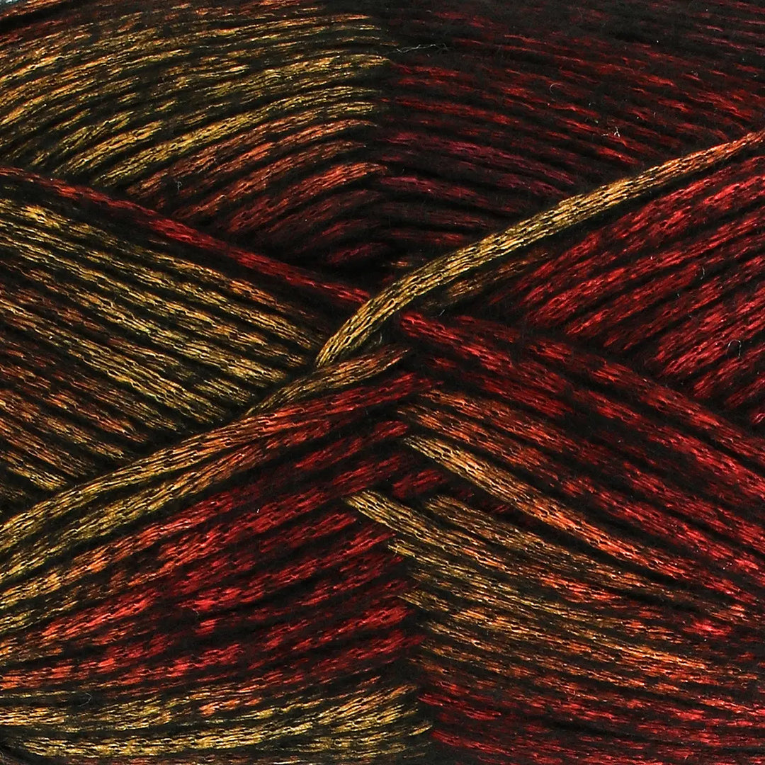 Close-up of multicolored yarn with red, gold, and black tones.