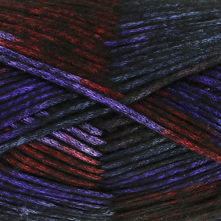 Close-up of multicolored yarn with red, purple, and black hues.