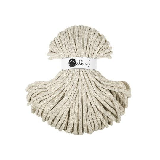 Ball of beige yarn with 'Bobbiny' label on a white background