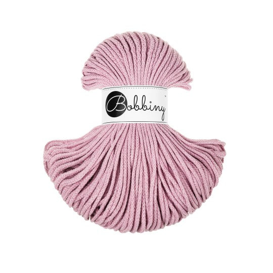 Pink skein of yarn with Bobbiny label on a white background
