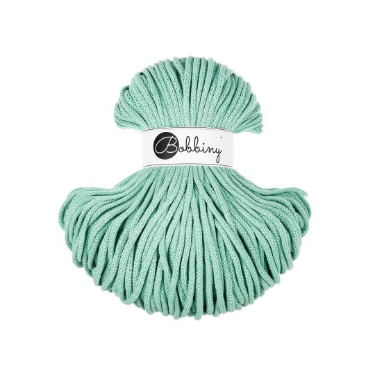 mint green yarn ball with &