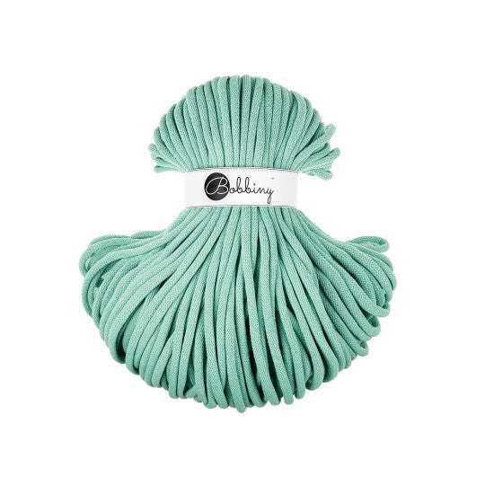 Ball of mint cord with 'Bobbiny' label on a white background