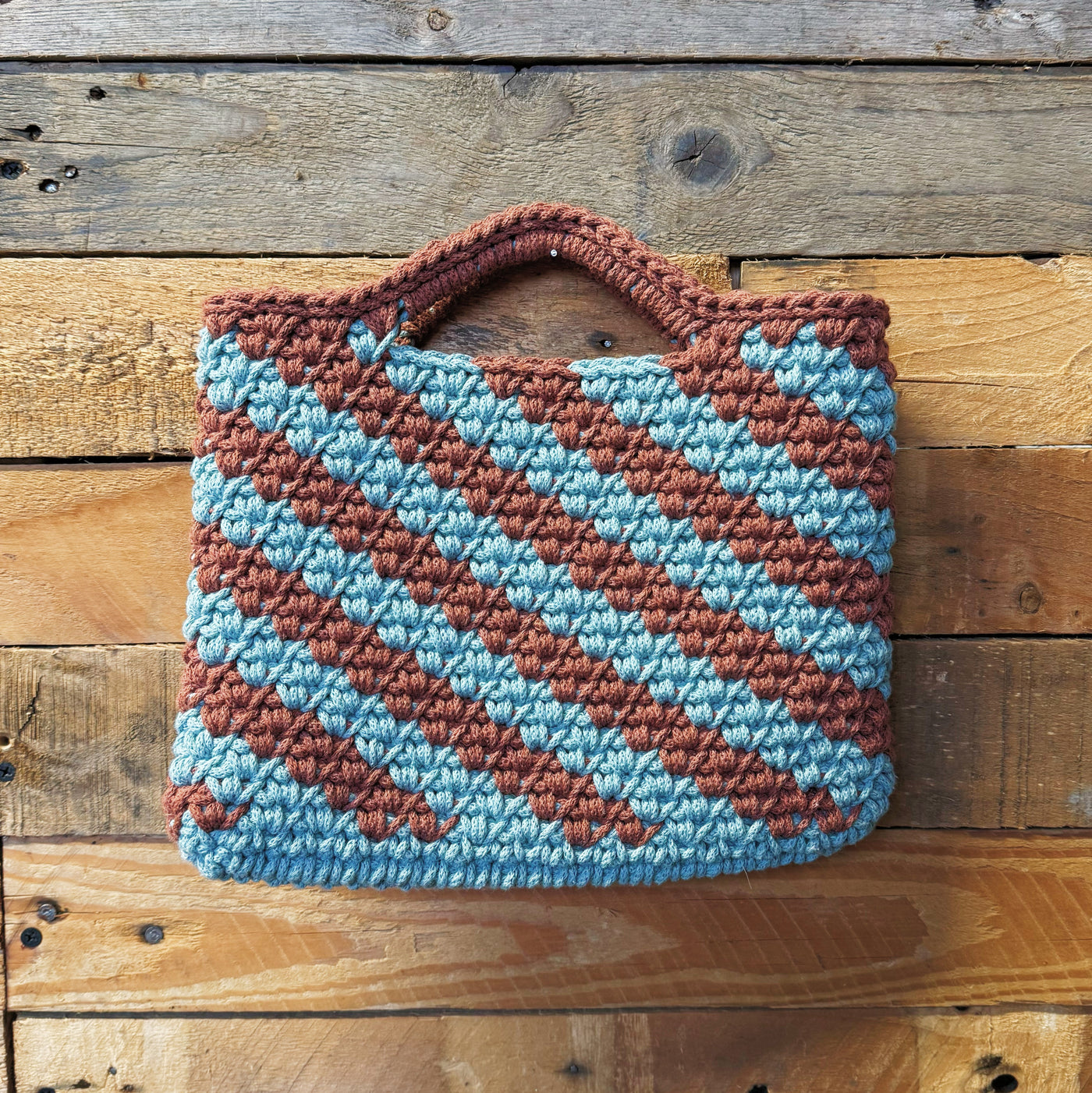two tone crochet clutch bag with large diagonal stripe