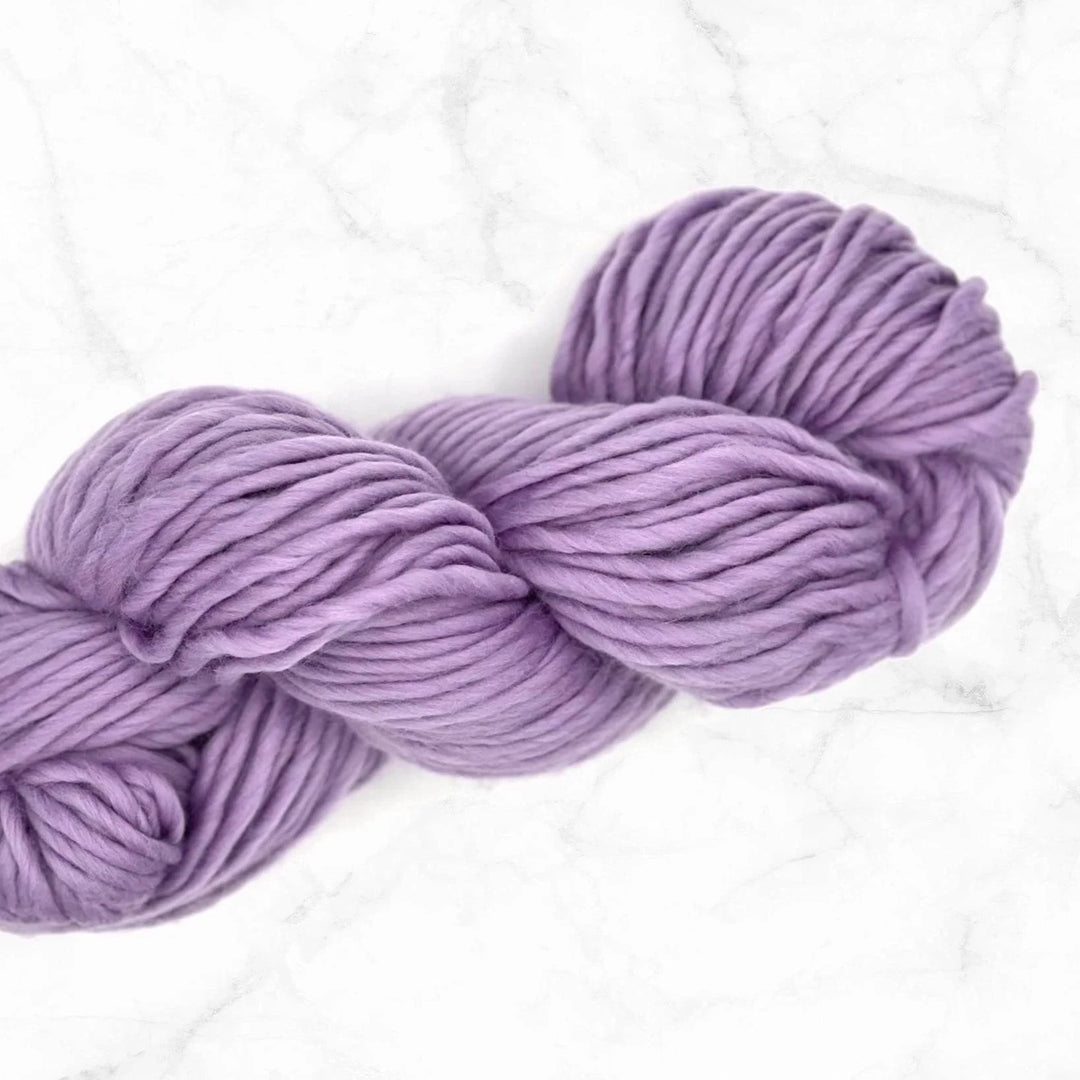 lavender yarn skein on a marble background