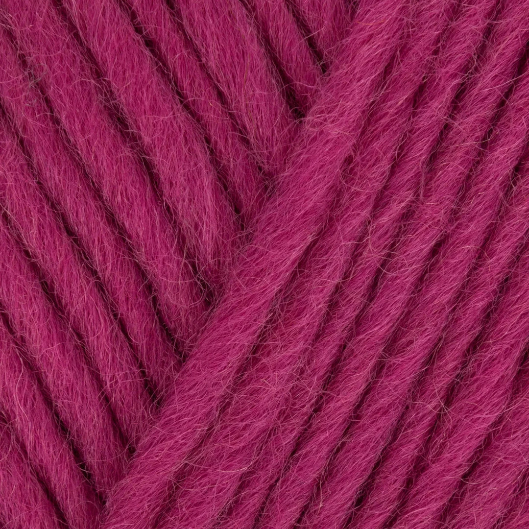 Close-up of pink yarn with a textured pattern